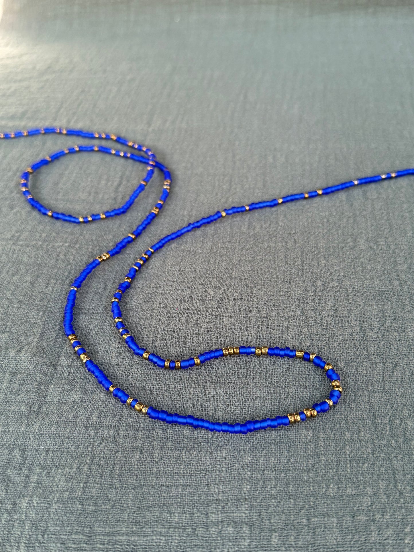 Electric blue waist beads – handmade Ghanaian body jewelry by Tòma Lina