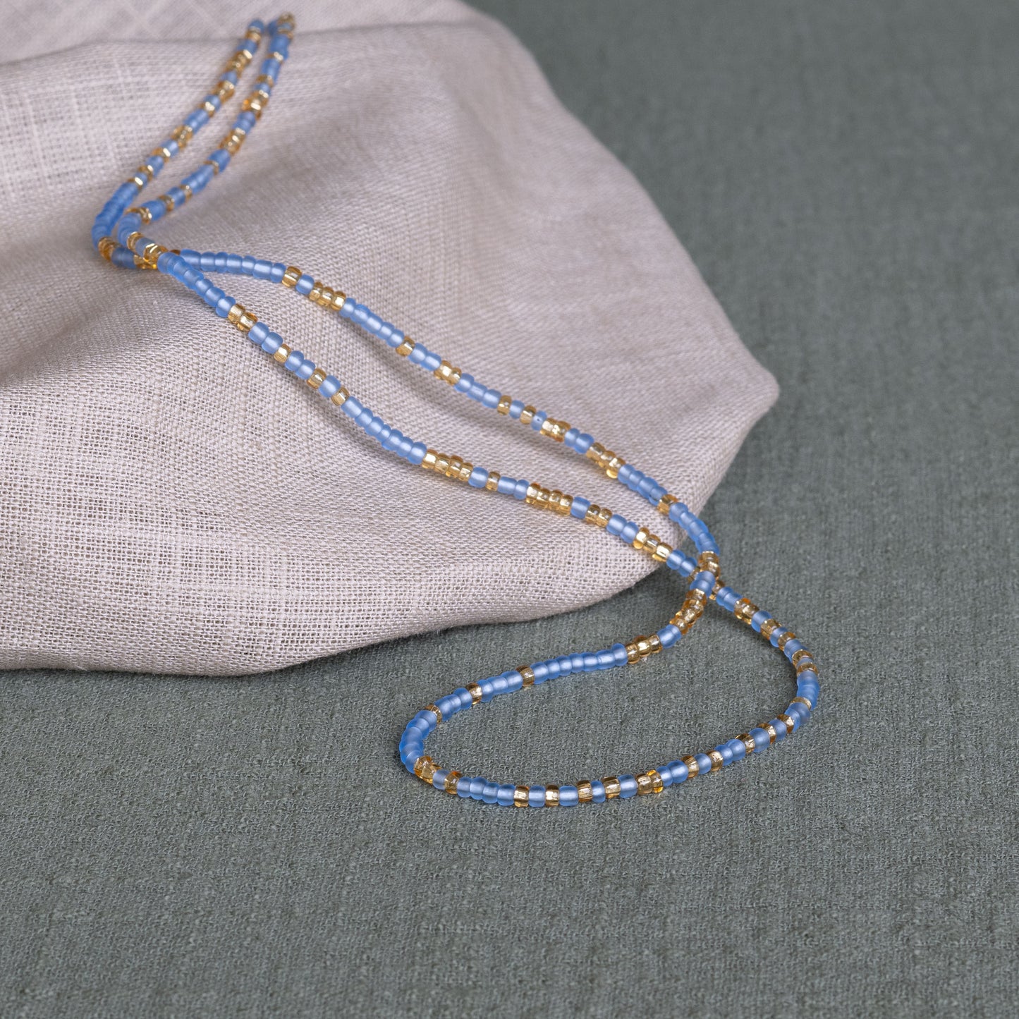 Cornflower waist beads in blue – handmade Ghanaian body jewelry by Tòma Lina