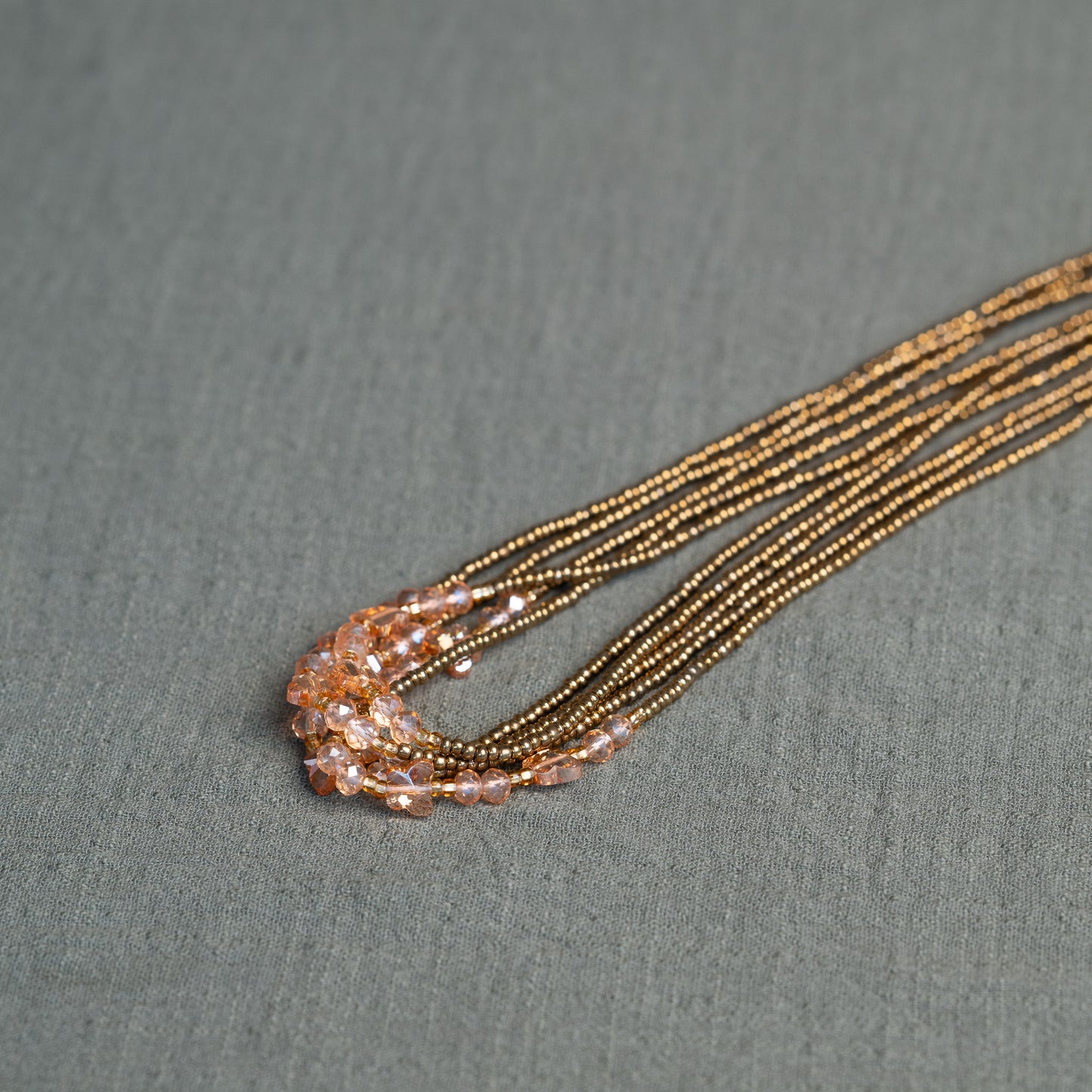 Waist beads with butterfly detail in pink and gold – spiritual African body jewelry handcrafted in Ghana for transformation.