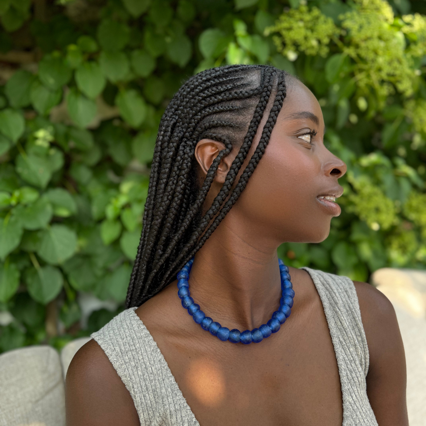 Royal Blue bold necklace in blue from Tòma Lina, shown how to wear around the neck