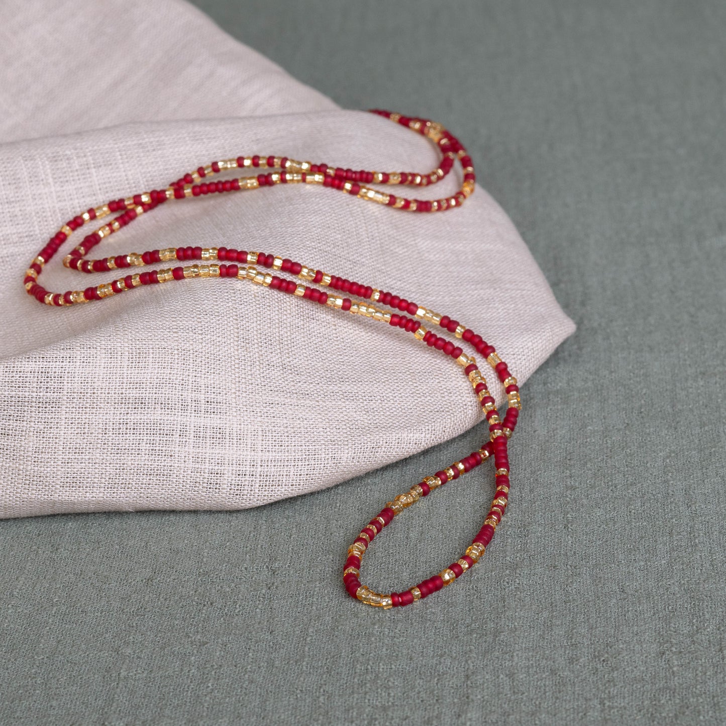 Soft Red waist beads in red – handmade Ghanaian body jewelry by Tòma Lina
