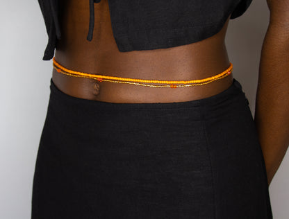 How to wear pumpkin spice waist beads in orange from Tòma Lina – handmade body jewelry