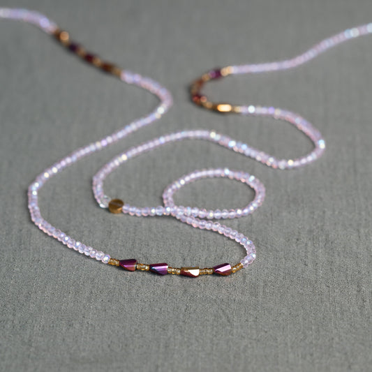 Luxury waist beads in blush pink and gold – handmade African body jewelry symbolizing self-love and feminine energy.