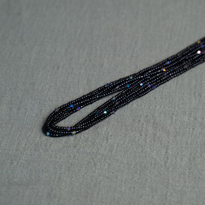 Tòma Lina Black Pearl waist bead, handmade with deep black Ghanaian beads symbolizing protection, grounding and feminine power.