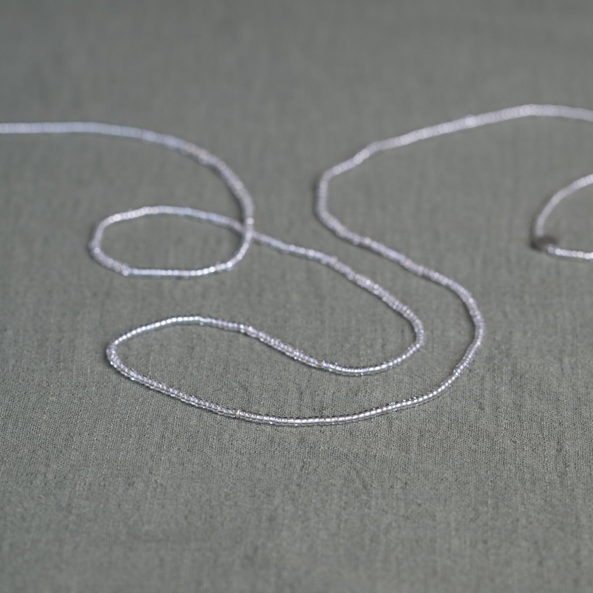 Tòma Lina Clear Beauty waist bead, handmade with transparent Ghanaian beads symbolizing clarity, purity and a fresh new beginning.