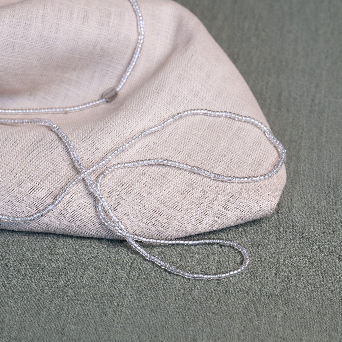 Tòma Lina Clear Beauty waist bead, handmade with transparent Ghanaian beads symbolizing clarity, purity and a fresh new beginning.