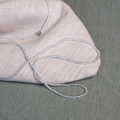 Tòma Lina Clear Beauty waist bead, handmade with transparent Ghanaian beads symbolizing clarity, purity and a fresh new beginning.