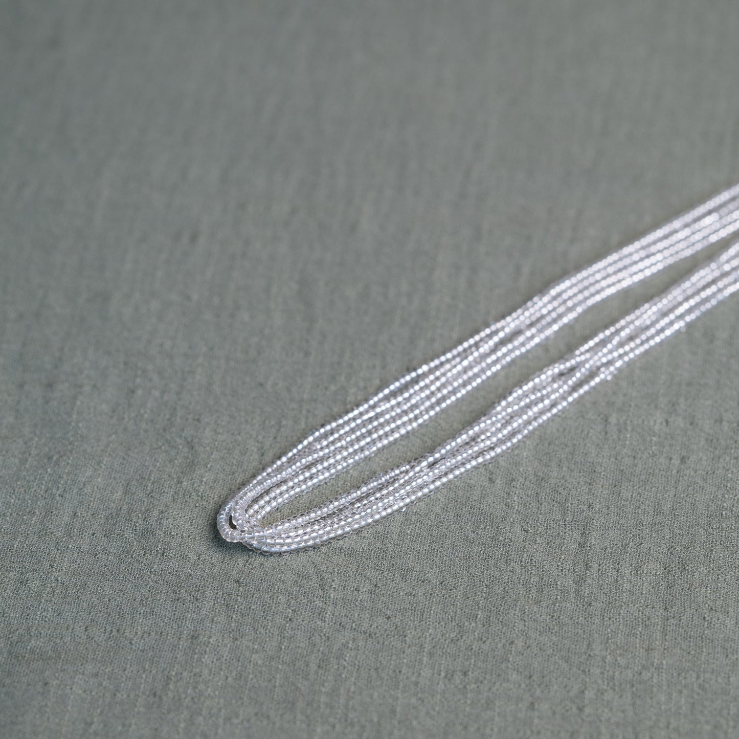 Tòma Lina Clear Beauty waist bead, handmade with transparent Ghanaian beads symbolizing clarity, purity and a fresh new beginning.