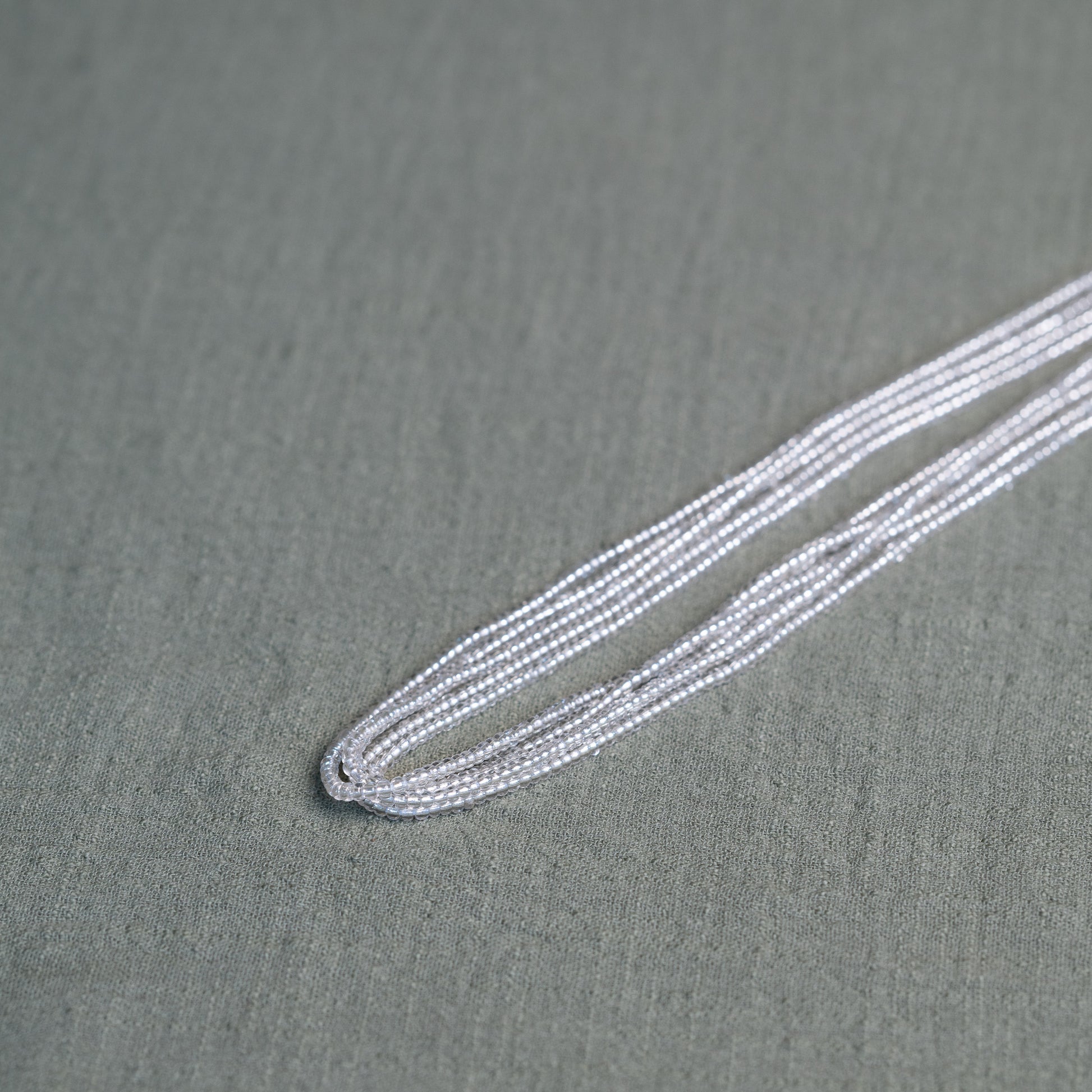 Tòma Lina Clear Beauty waist bead, handmade with transparent Ghanaian beads symbolizing clarity, purity and a fresh new beginning.