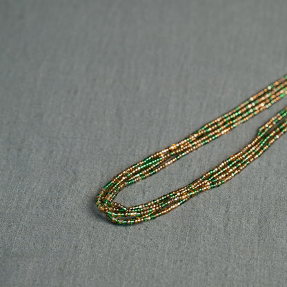 Tòma Lina Emerald Green waist bead, handmade with authentic Ghanaian beads in a deep green shade symbolizing growth and renewal.