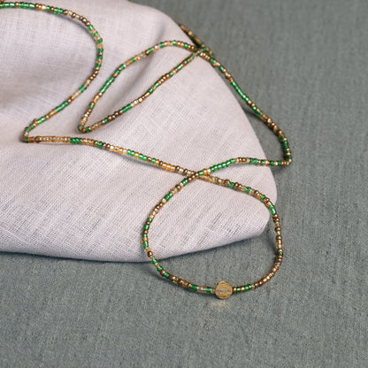 Tòma Lina Emerald Green waist bead, handmade with authentic Ghanaian beads in a deep green shade symbolizing growth and renewal