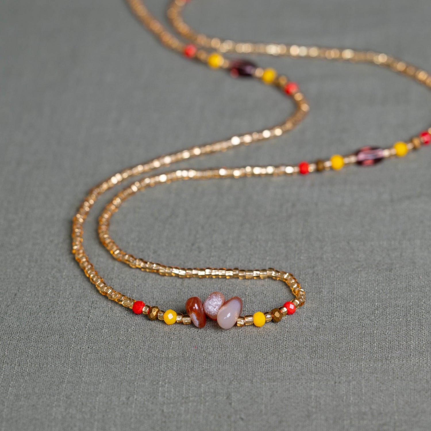 Gemstone waist beads in gold tones– handmade Ghanaian body jewelry by Tòma Lina