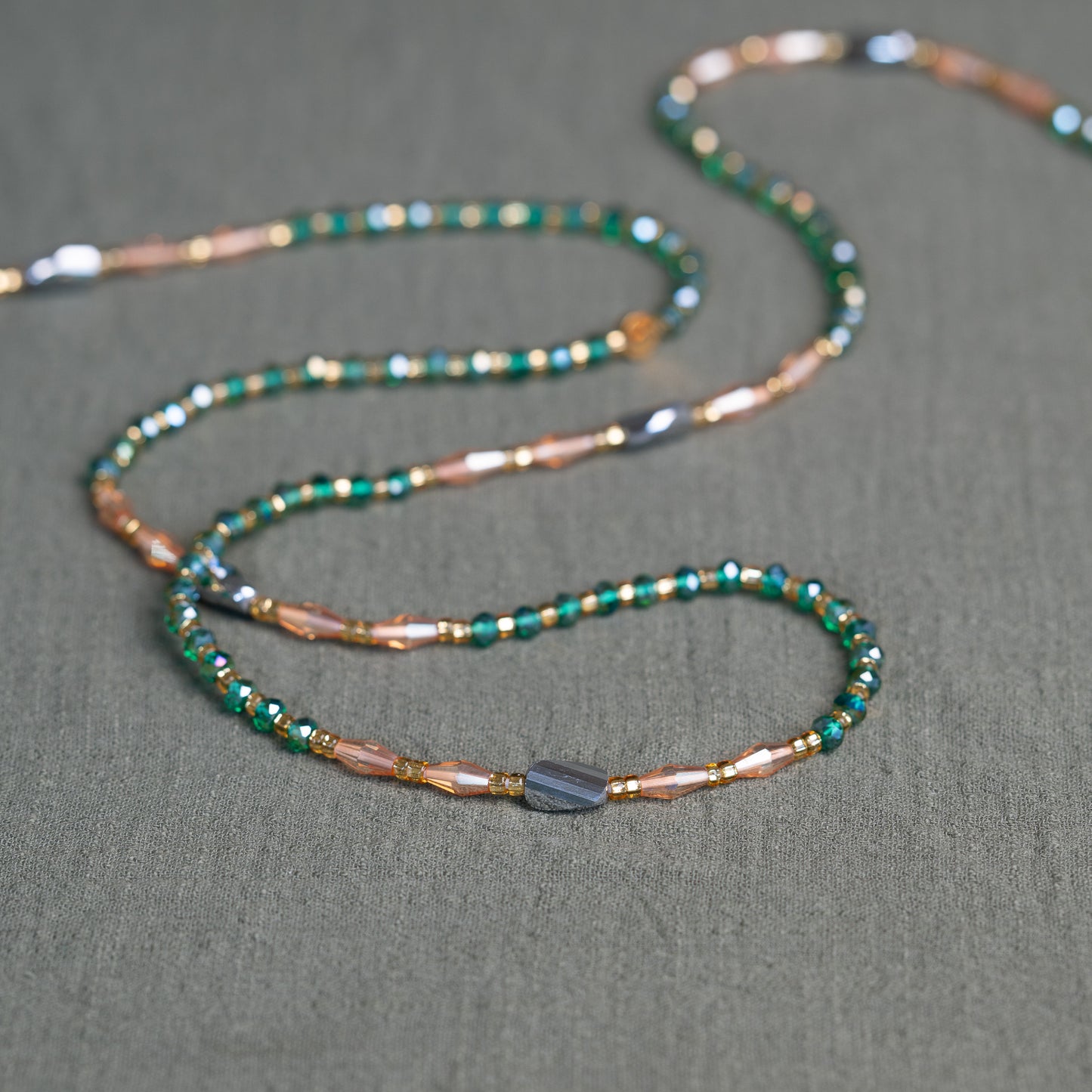 Emerald green and bronze African waist beads – handmade tie-on jewelry symbolizing growth, fire and grounding energy.