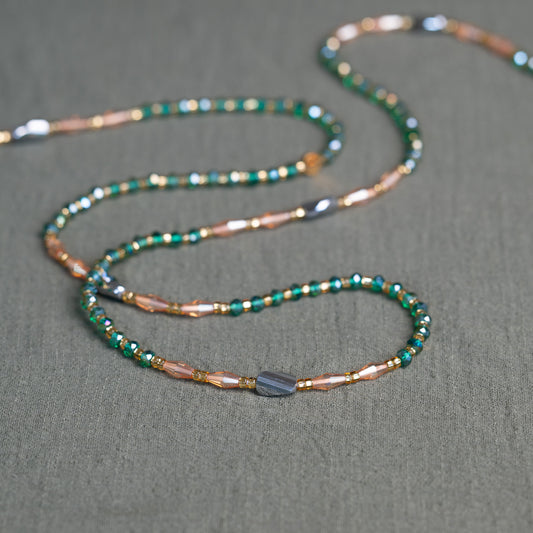 Emerald green and bronze African waist beads – handmade tie-on jewelry symbolizing growth, fire and grounding energy.