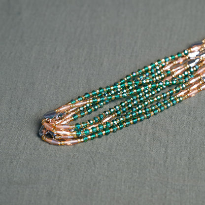 Emerald green and bronze African waist beads – handmade tie-on jewelry symbolizing growth, fire and grounding energy.