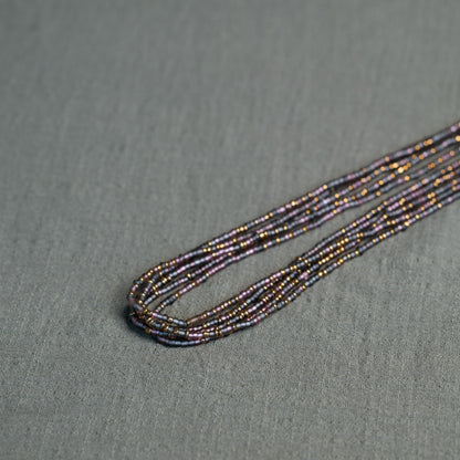 Tòma Lina Purple Rain waist bead, handmade with authentic Ghanaian beads in a rich purple tone symbolizing intuition, empowerment and spiritual depth.