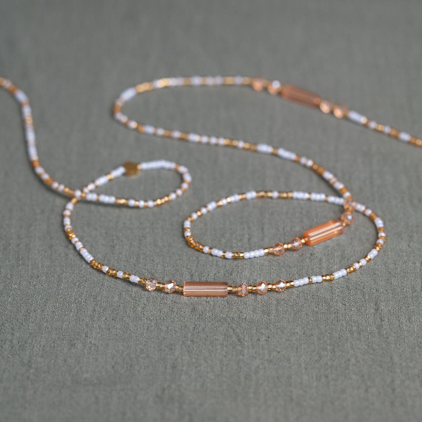 White and gold African waist beads – spiritual tie-on body jewelry handcrafted in Ghana for purity and clarity.