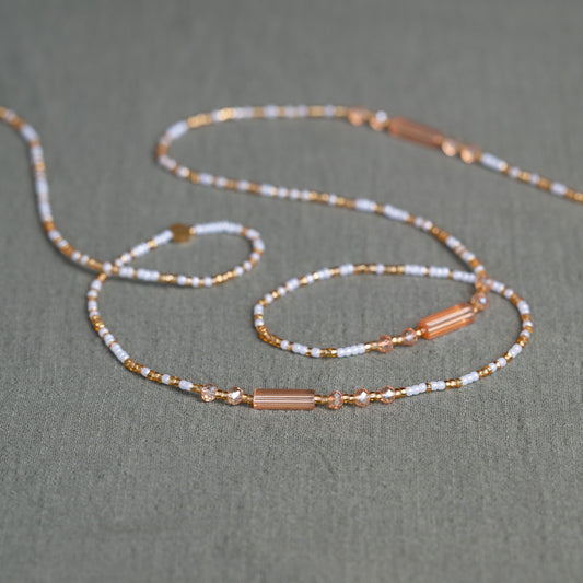 White and gold African waist beads – spiritual tie-on body jewelry handcrafted in Ghana for purity and clarity.