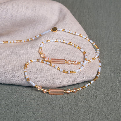 White and gold African waist beads – spiritual tie-on body jewelry handcrafted in Ghana for purity and clarity.